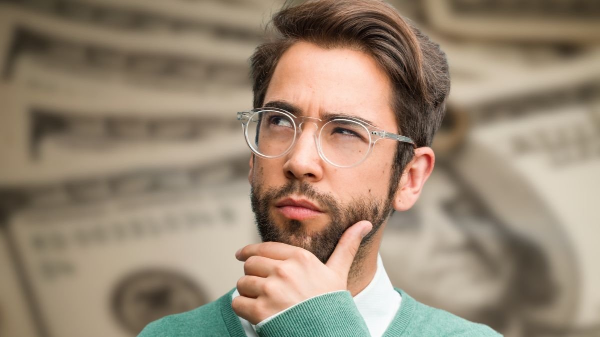 man glasses thinking green sweater