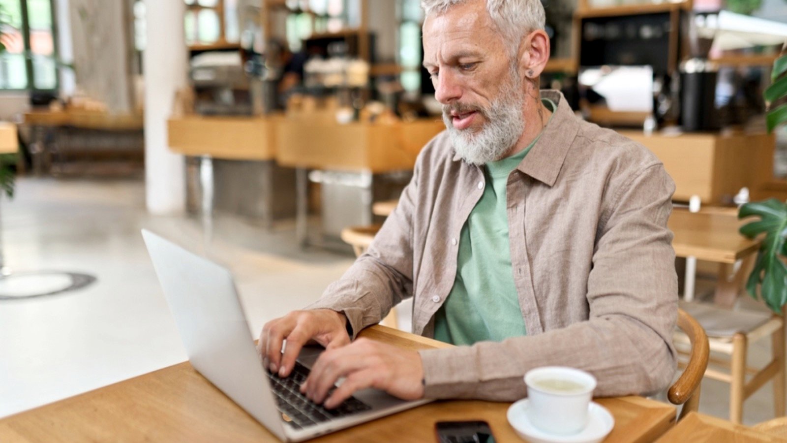 15 Remote Gigs Ideal for Adults Over 60 Old man with laptop