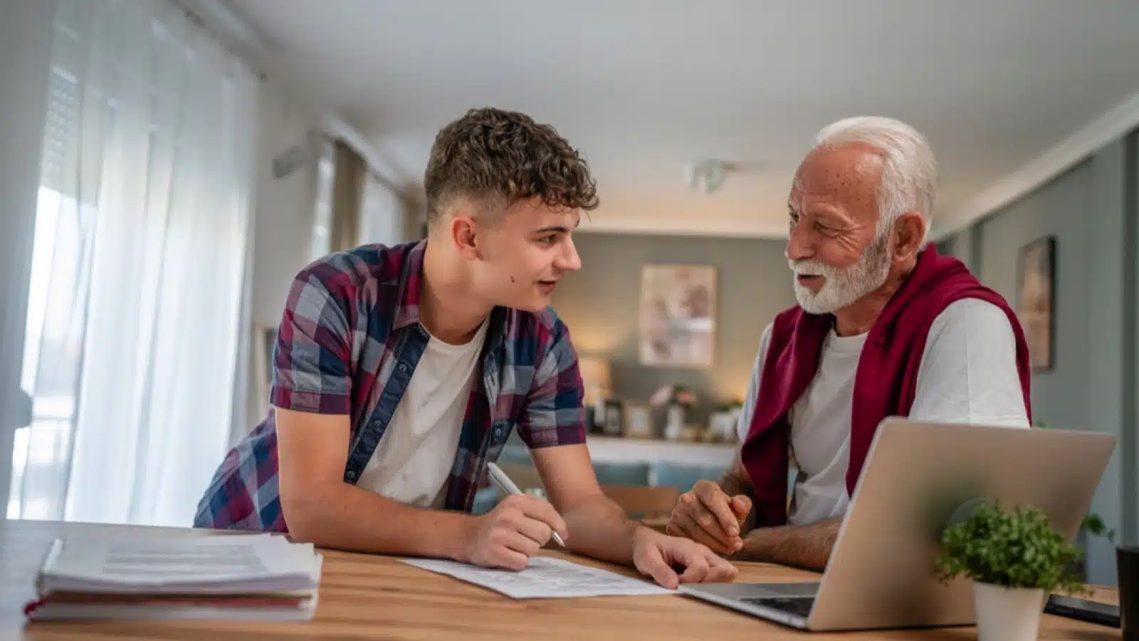 15 Remote Gigs Ideal for Adults Over 60 Teen helping old man with laptop