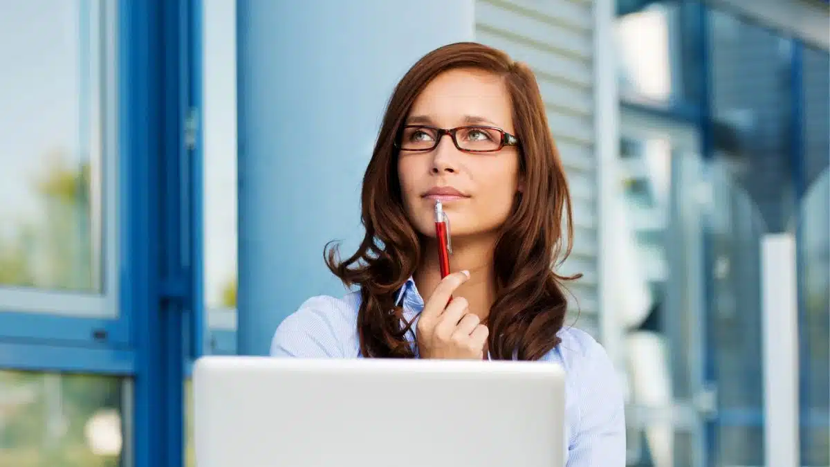 woman glasses on laptop