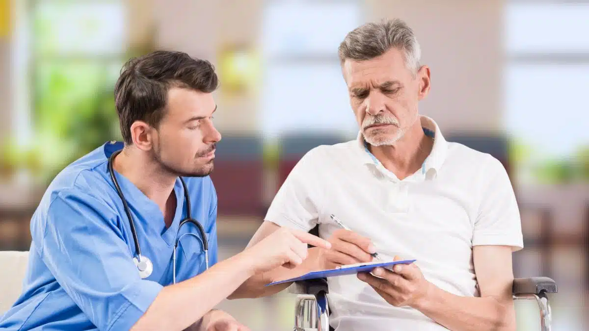 elder man sitting in waiting room healthcare