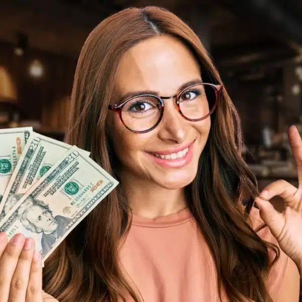 woman glasses holding cash happy smile