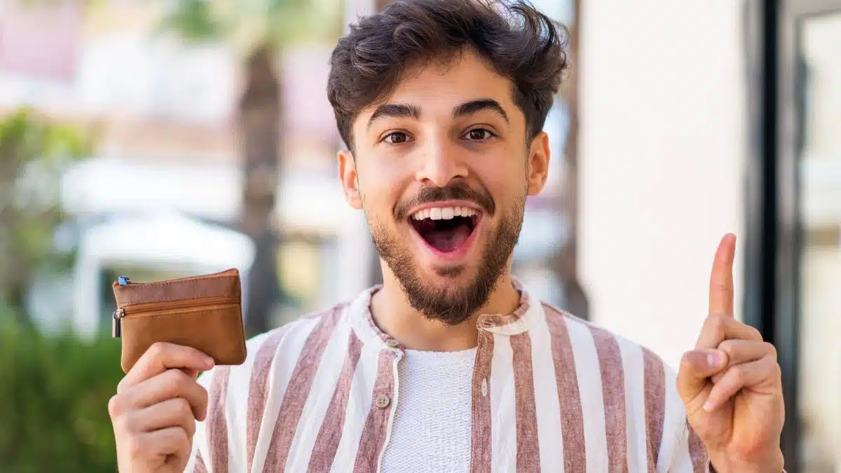 man happy with wallet happy outside