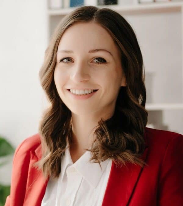 woman boss sitting at a desk smiling