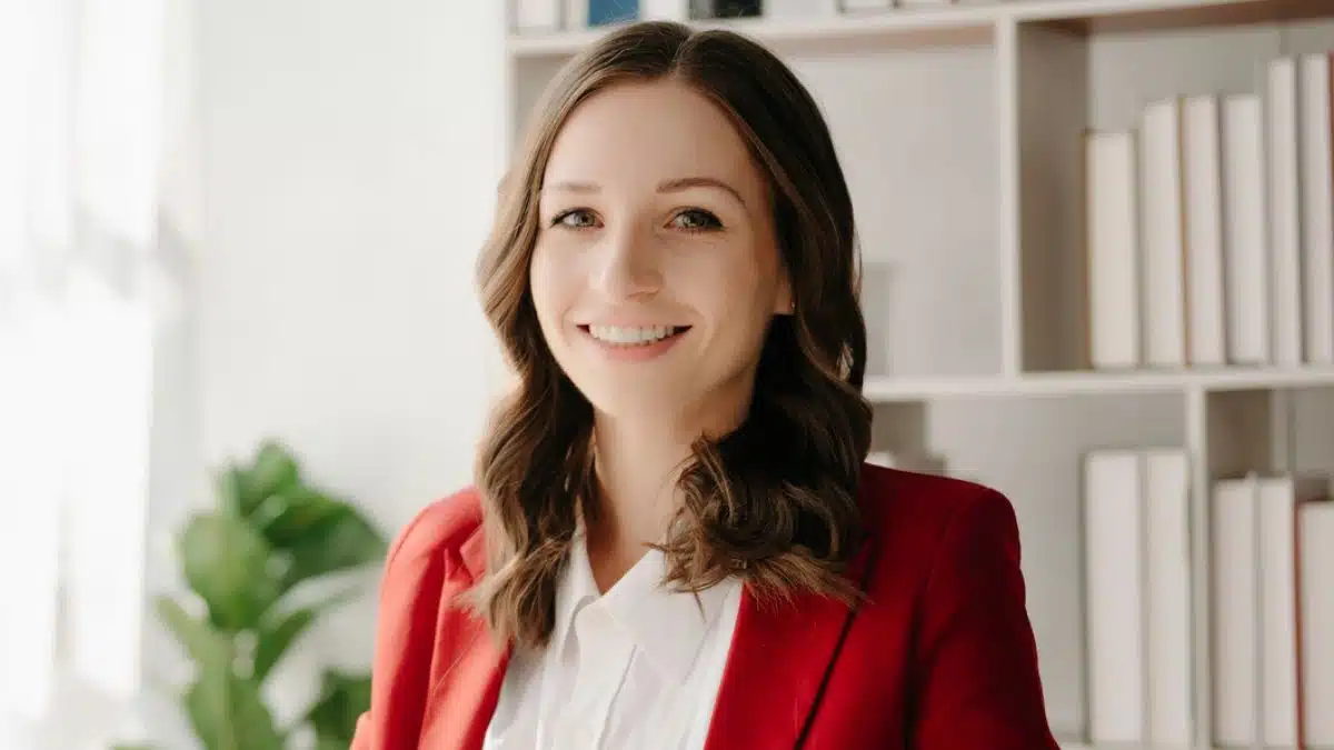 woman boss sitting at a desk smiling