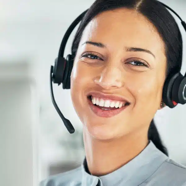 young woman wearing a headset at home