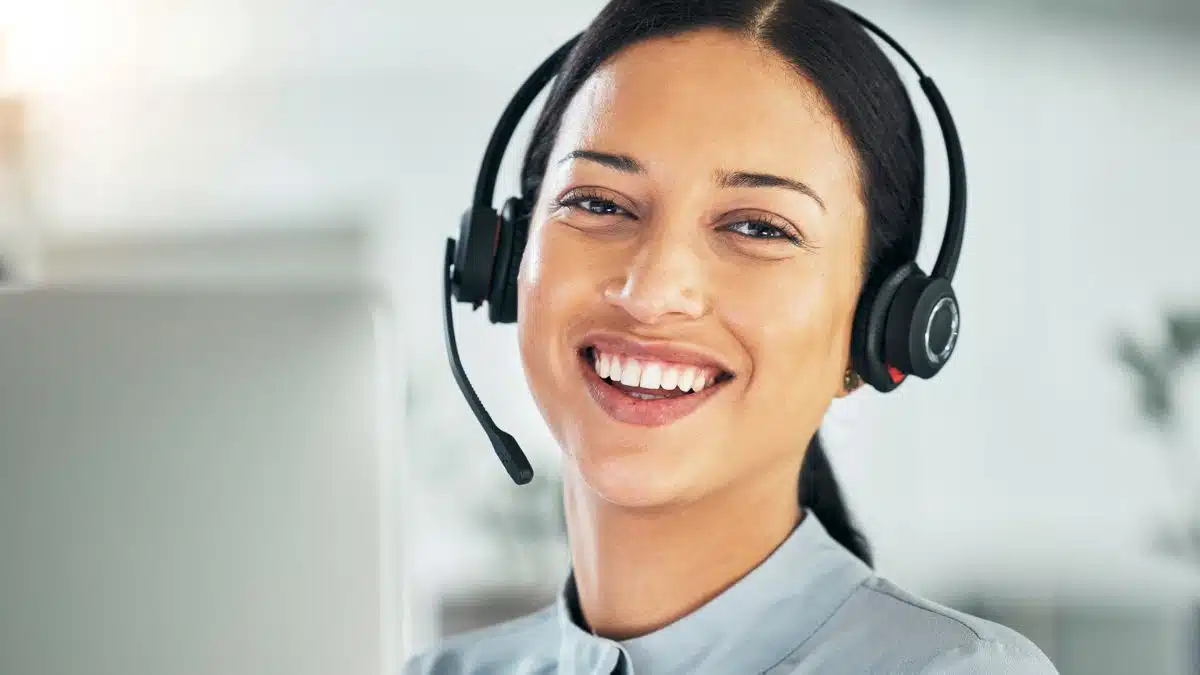 young woman wearing a headset at home